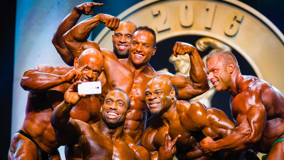 Arnold Classic group shot selfie on stage.